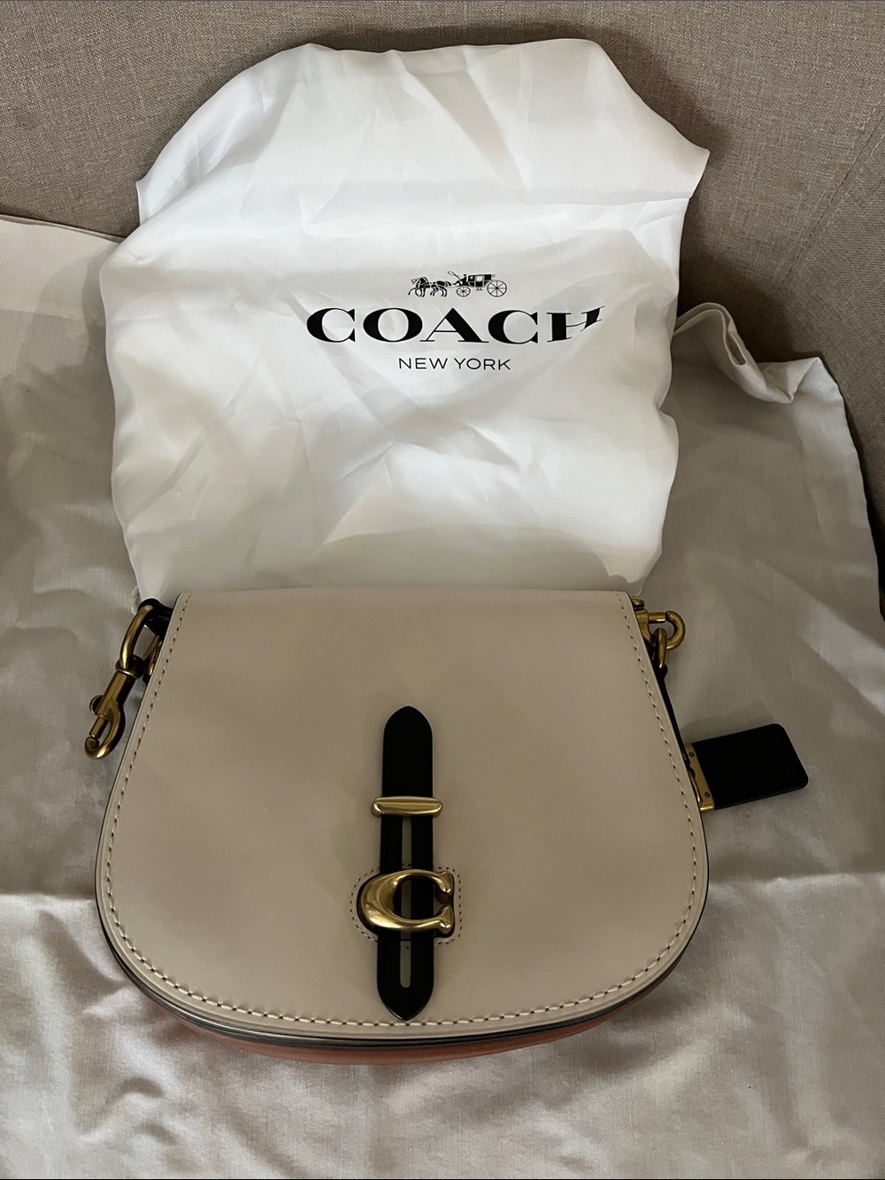 Coach Women's Cream Leather Saddle Crossbody with Black Accent